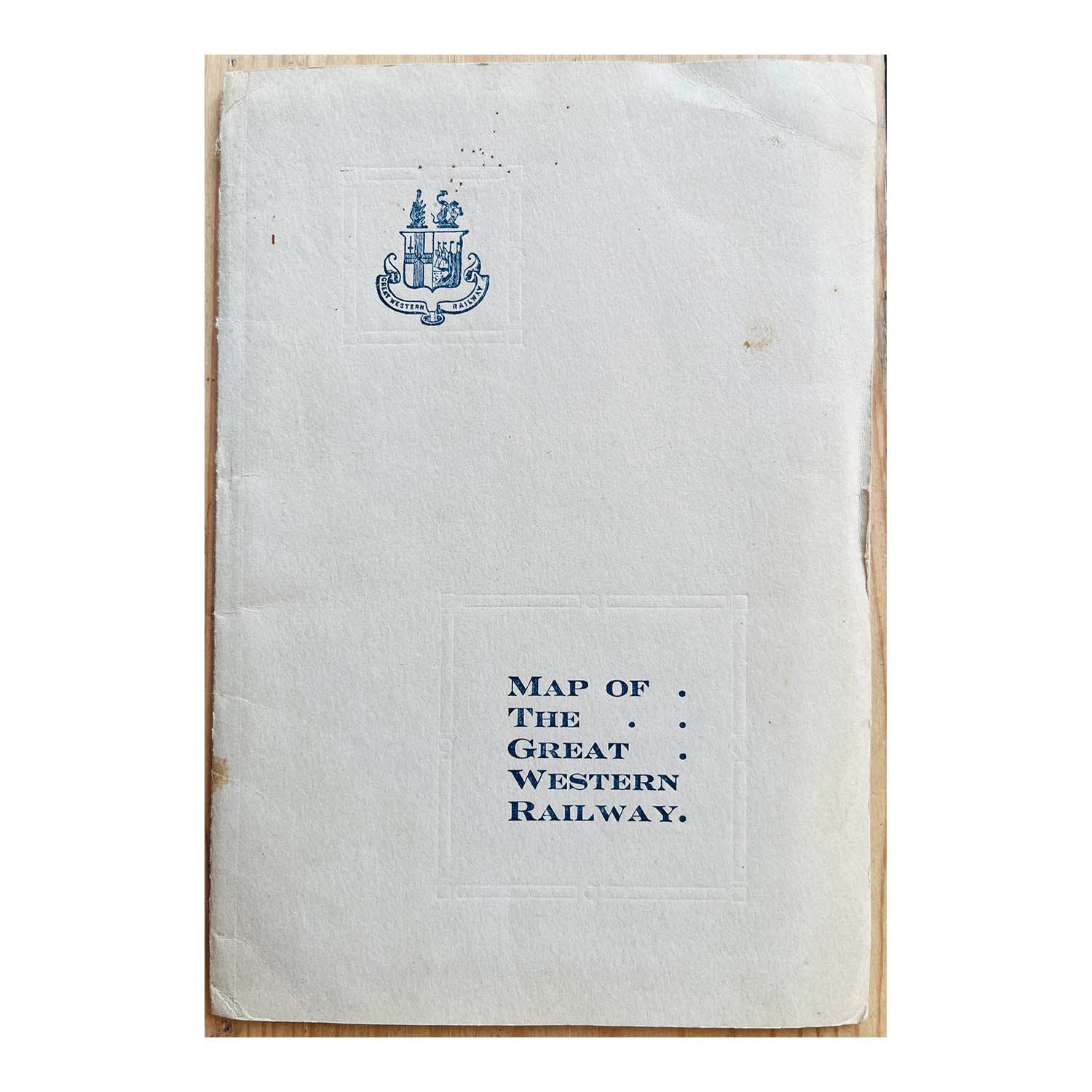 Original folding Map of the Great Western Railway, contained within original card covers printed with the Arms of the GWR, c.1920.