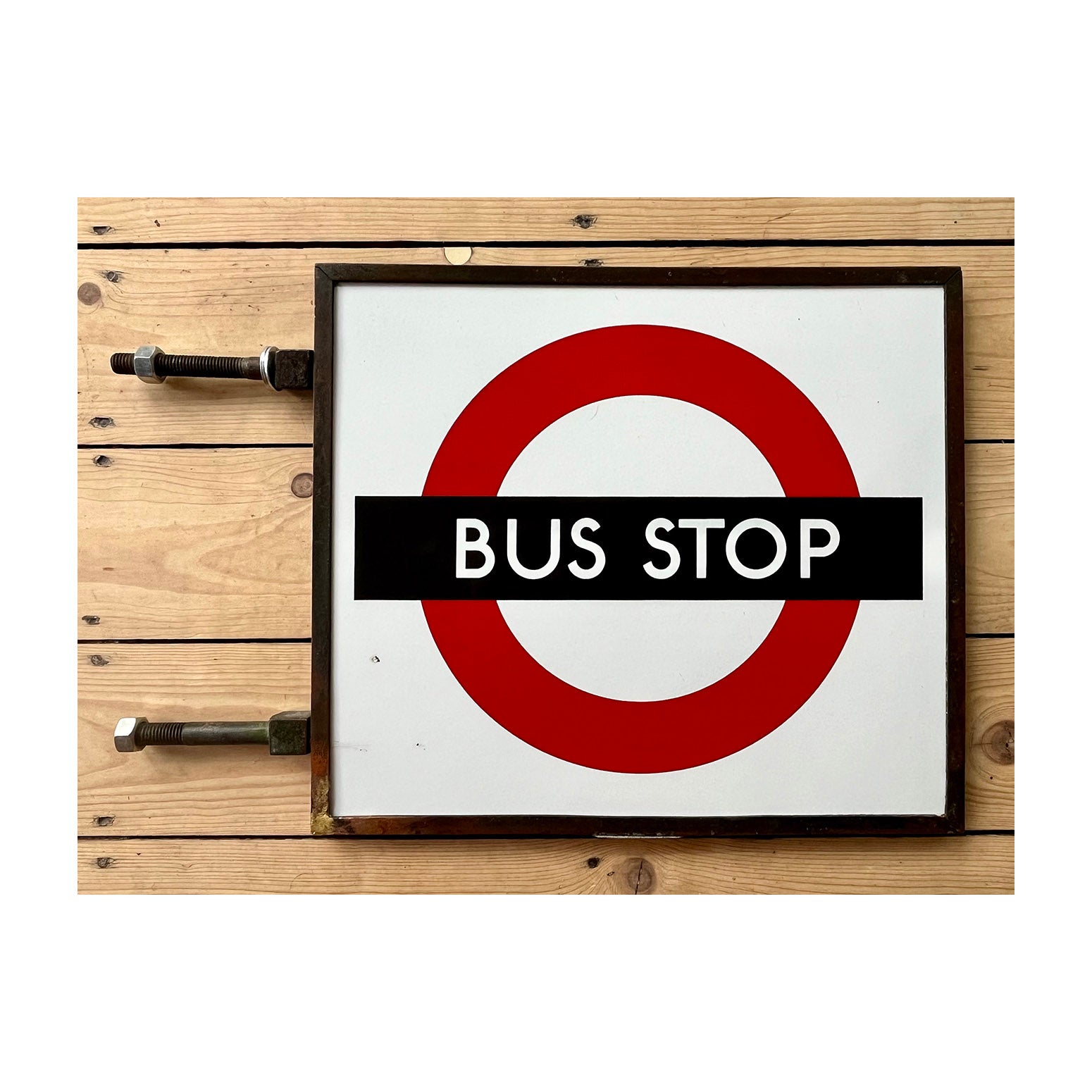 London Transport (LT) double sided, bronze framed, enamel bus stop flag, c. 1950. This is the truly iconic version of the LT bus stop sign, introduced in the 1930s.