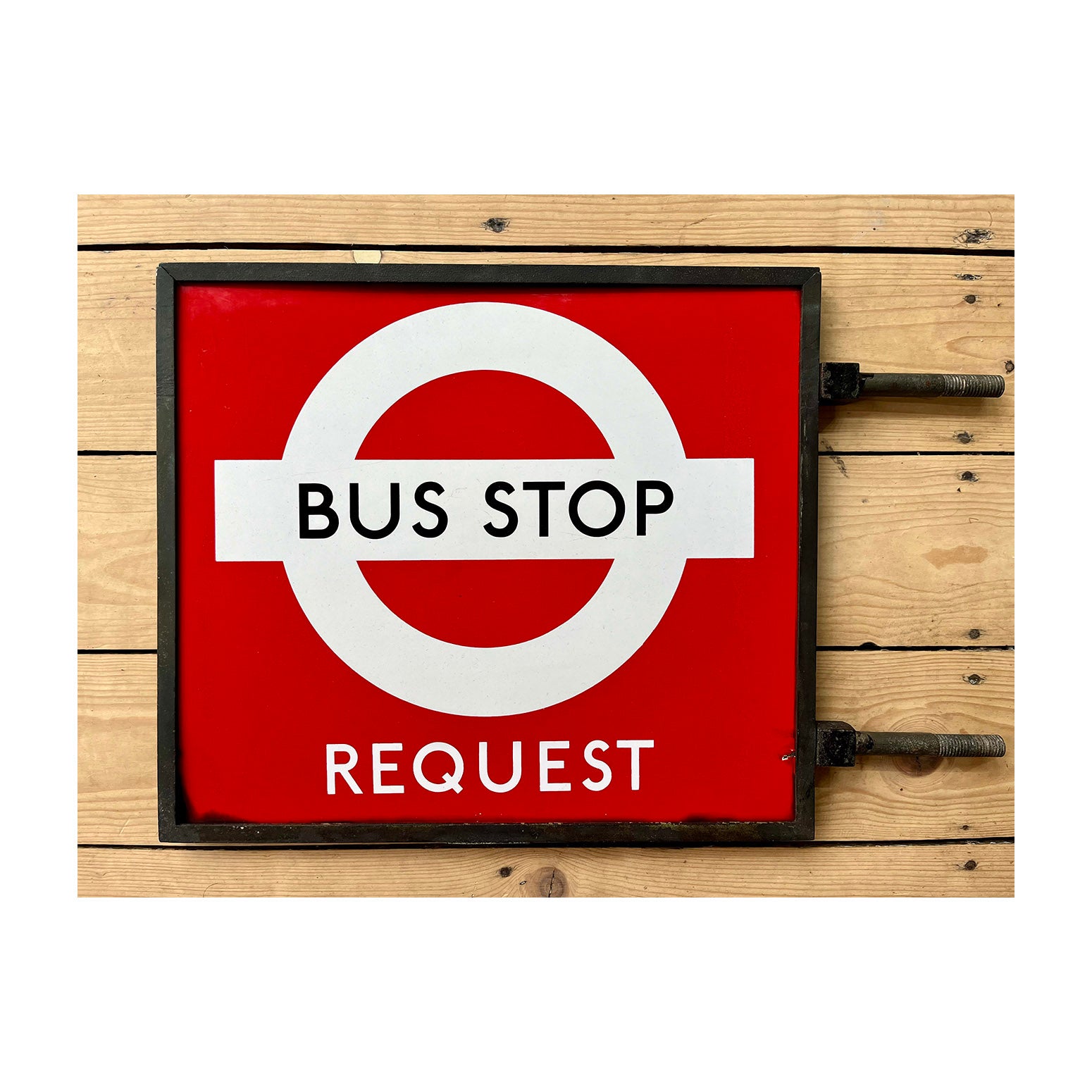  original London Transport (LT) double sided, bronze framed, enamel ‘Request’ bus stop flag, c. 1950. This red ‘Request’ version of the iconic blue/white LT bus flag was designed by Hans Schleger in the mid-1930s