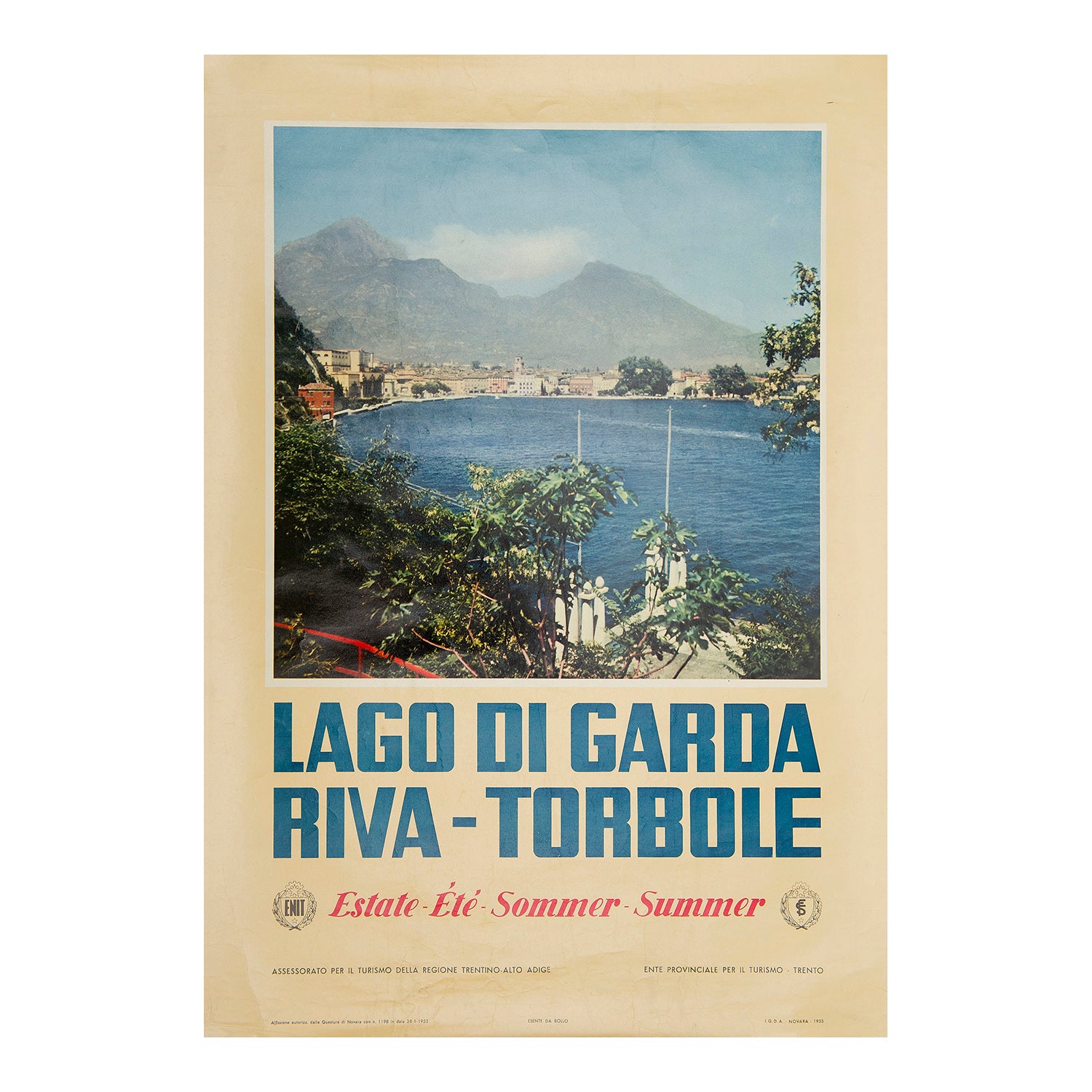 An original poster, published by the Italian Tourist Board for Lake Garda in northern Italy, 1953. The photographic image features the picturesque town of Riva, located on the Lake’s northernmost tip.