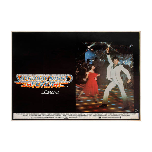 Original theatrical release film poster, Saturday Night Fever, 1977. British Quad size. The image depicts the film’s star, John Travolta, strutting his stuff as Tony Manero 