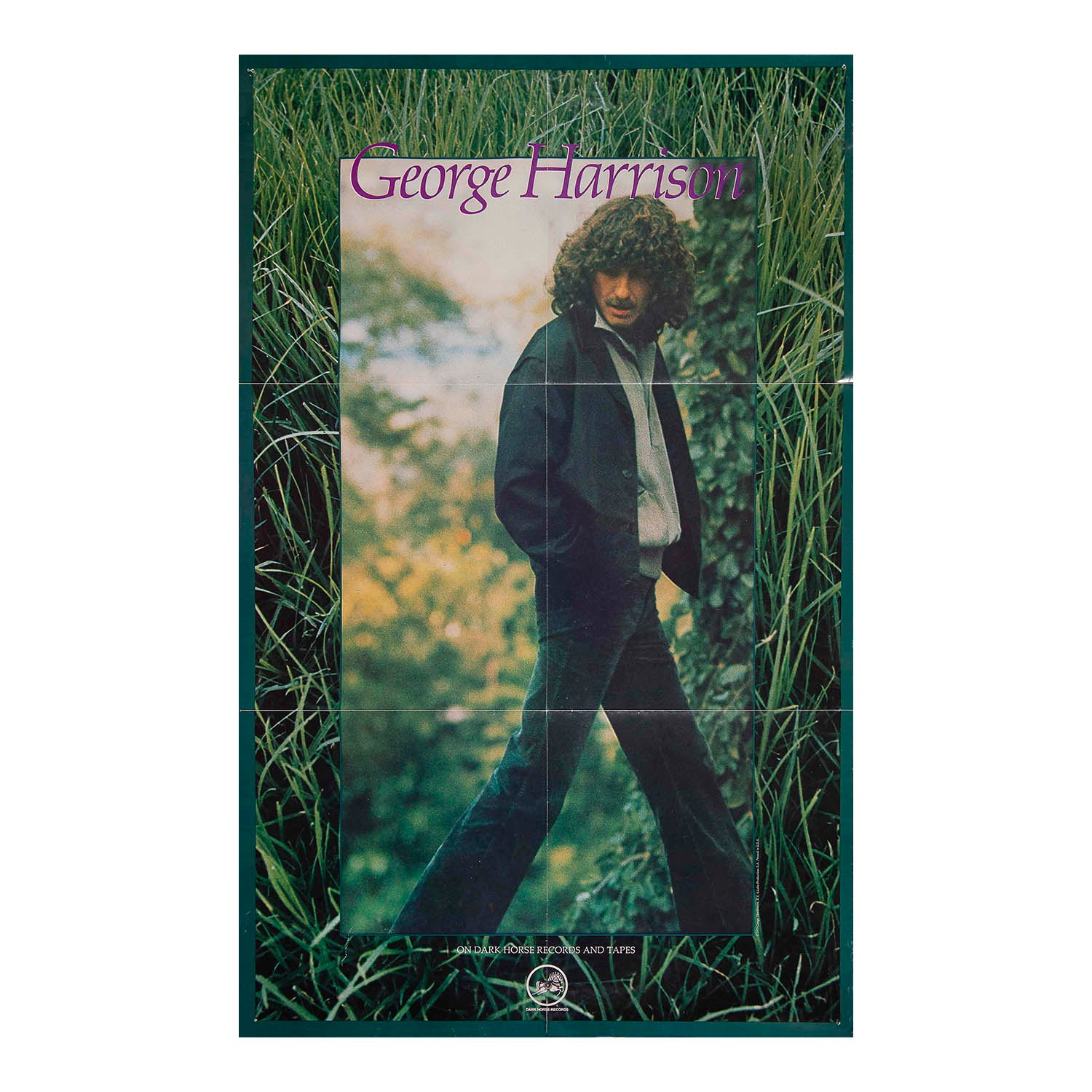 A vintage-style poster or print featuring a portrait of George Harrison standing in tall grass, with his name in purple text at the top and a dark border around the artwork.