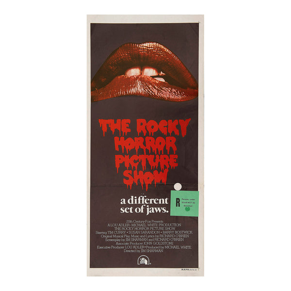 Original movie poster, Rocky Horror Picture Show, 1975. This is the Australian day-bill format which has a New Zealand green R18 ratings snipe added over the Australian rating. The design features the film’s famous red lips motif above the tagline ‘a different set of jaws’