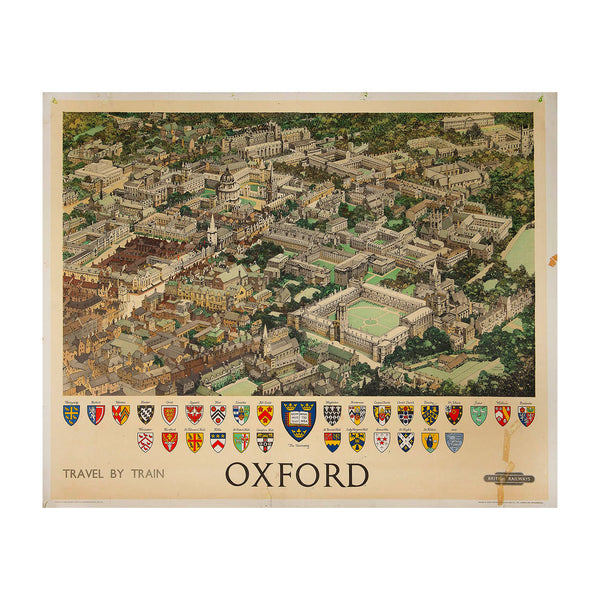 An outstanding original railway poster showing a bird’s eye view of Oxford University by the renowned poster artist Fred Taylor (1875-1963) , c. 1950.

The design depicts an aerial map view of Oxford including the historic University, Christ Church Cathedral and other notable landmarks with the university college crests below including Balliol, Merton, Exeter, Oriel, Queen's, New, Lincoln, All Souls, Magdalen, Brasenose, Corpus Christi, Christchurch, Trinity, St John's, Jesus, Wadham, Pembroke, Worcester