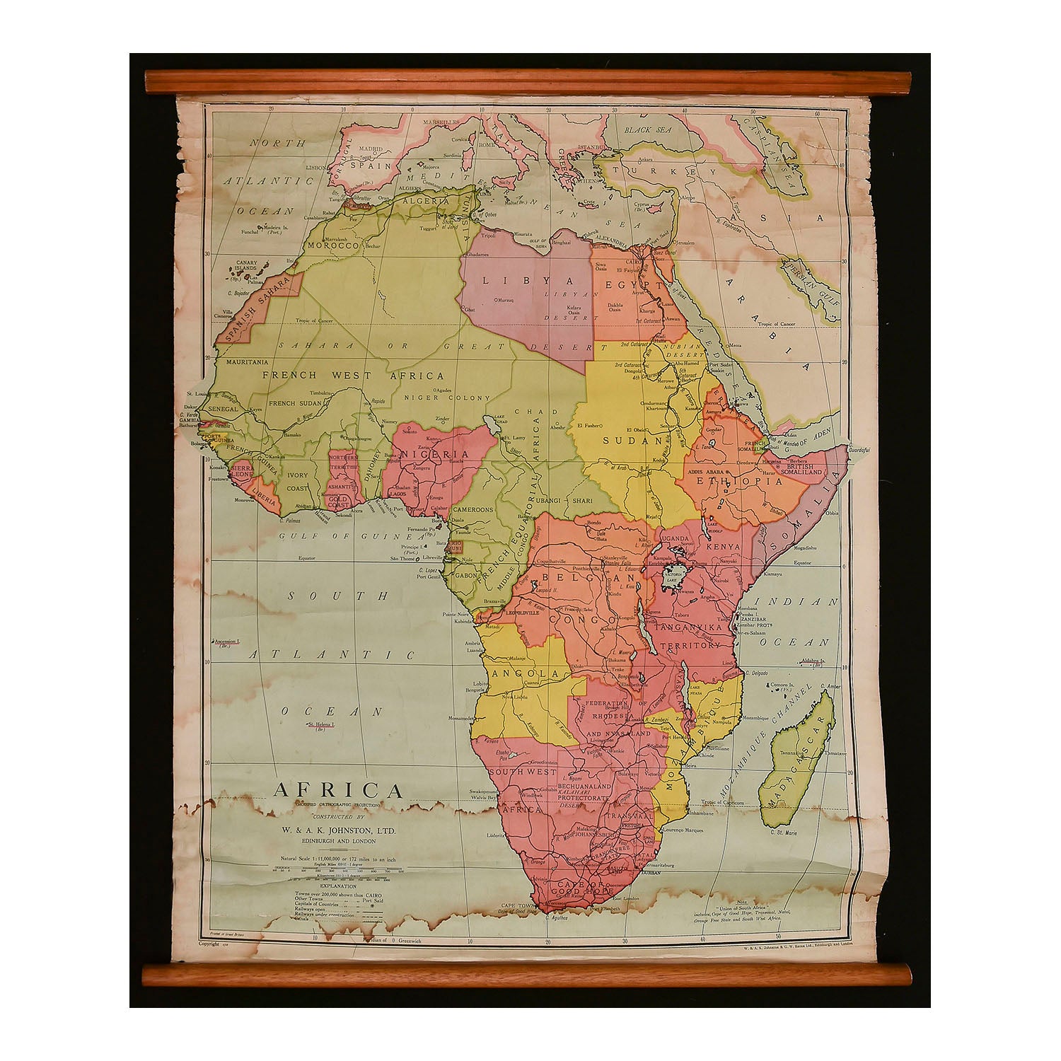 original linen backed map of Africa on pine rollers, published by W & AK Johnston Limited, 1956. Scale 1:11,000,000. Map shows country names and boundaries as they existed at the time.