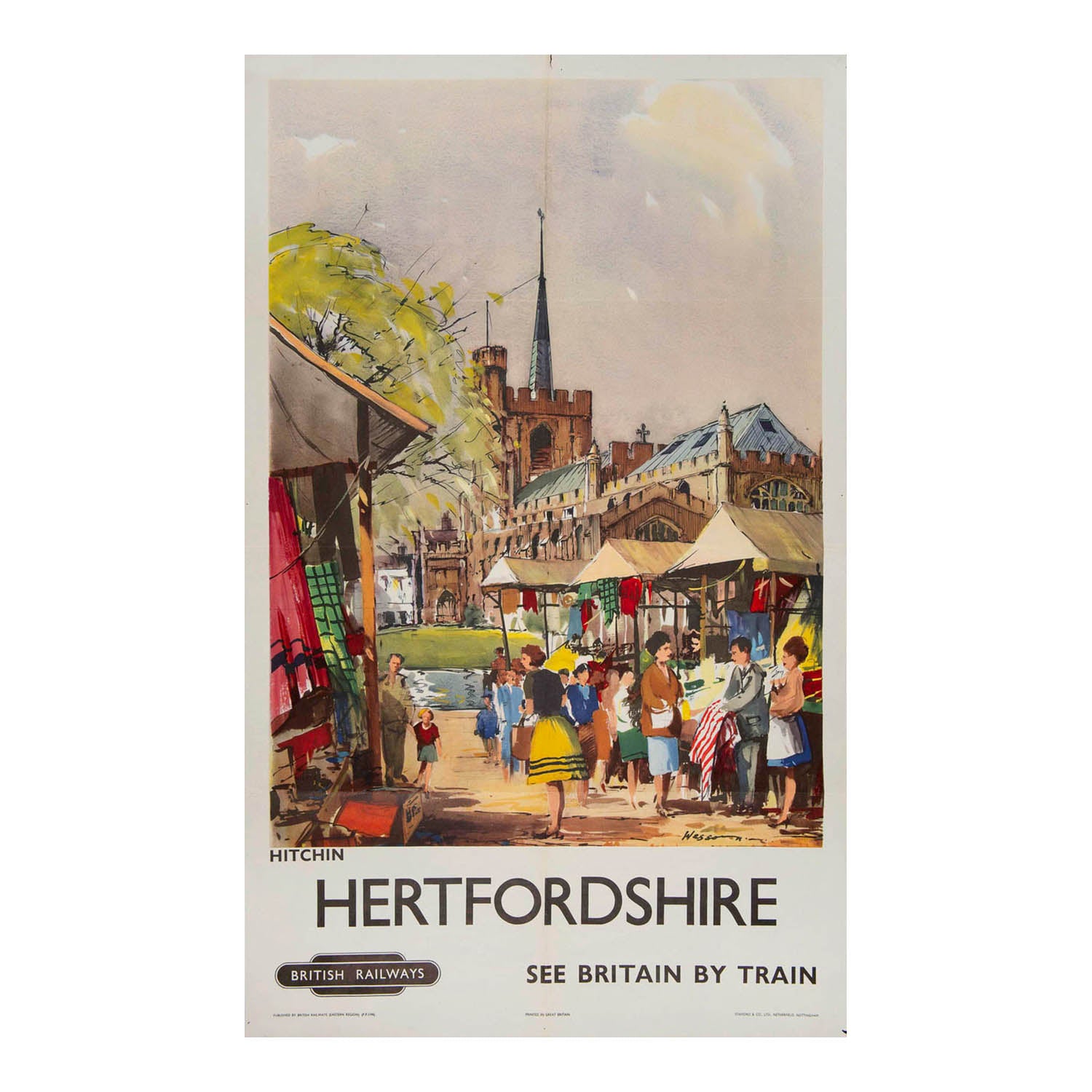  railway travel poster, Hertfordshire. See Britain by Train, by Frank Wooton, 1958. The vibrant design depicts a market day scene in Hitchin with St Mary’s church in the background