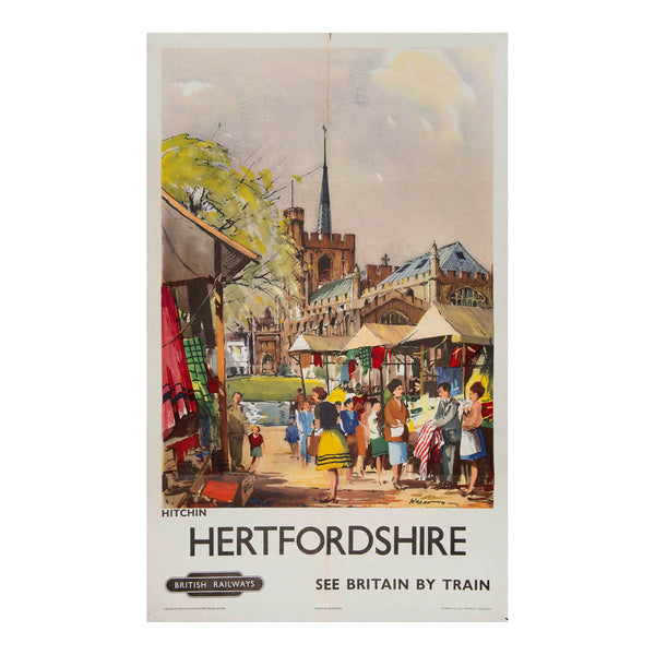  railway travel poster, Hertfordshire. See Britain by Train, by Frank Wooton, 1958. The vibrant design depicts a market day scene in Hitchin with St Mary’s church in the background
