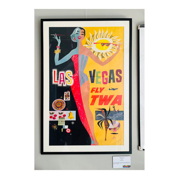 An original, framed, airline travel poster, Las Vegas Fly TWA, designed by the noted American Artist David Klein for Trans World Airlines, c. 1960. The colourful ‘split-screen’ design highlights the daytime and nocturnal attractions of Las Vegas by presenting a female holiday maker dressed for the beach (right side) and the casino (left side).