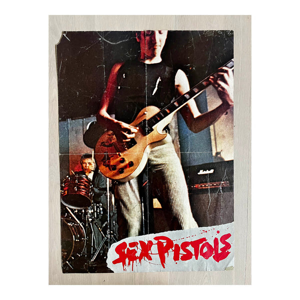 Original double-sided poster, The Sex Pistols, 1977. The reverse includes details about the Pistols together with a montage of photographs, posters and newspaper covers.