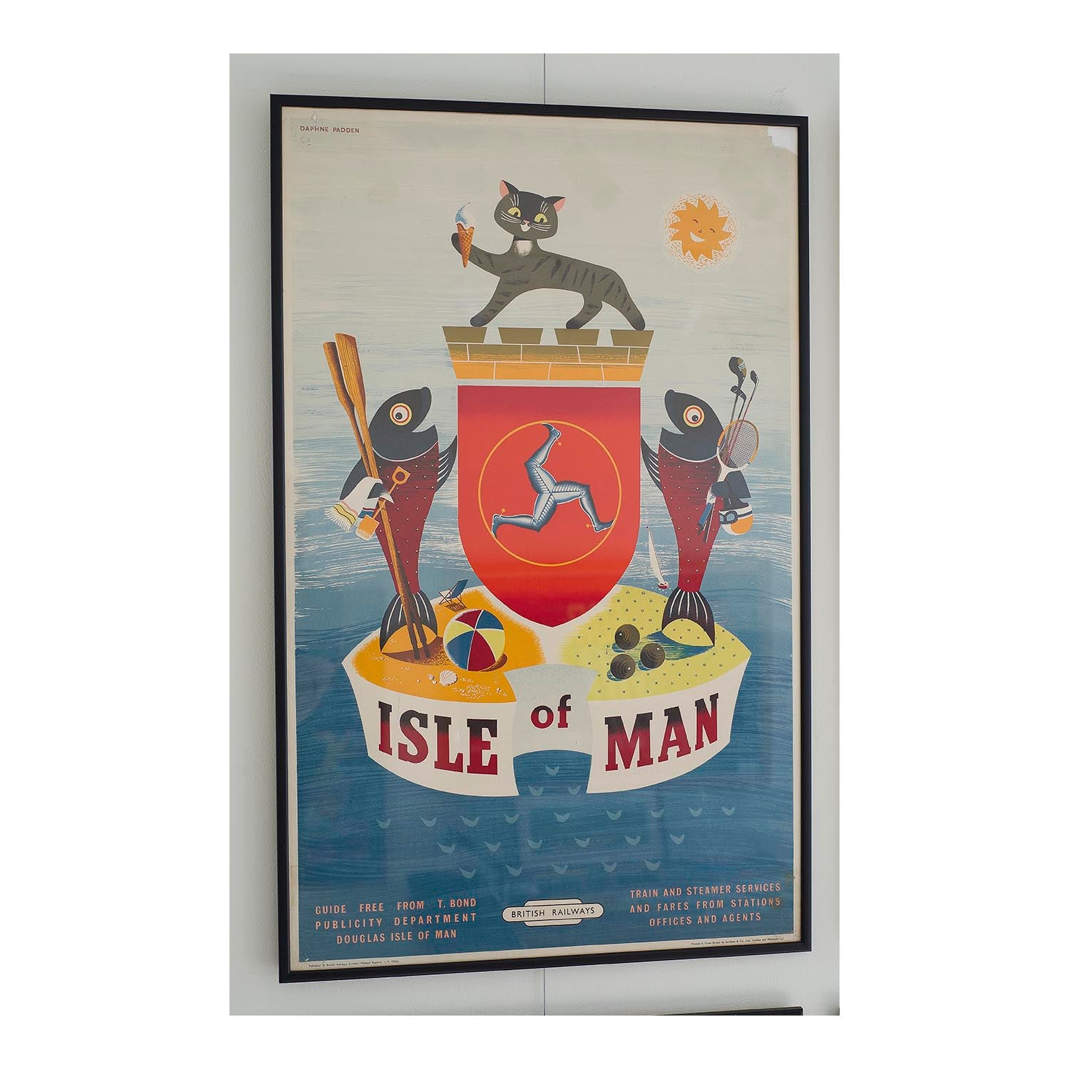 Original railway poster Isle of Man by Daphne Padden. Comical version of island’s crest, depicting holiday making fish and a Manx cat holding an ice cream