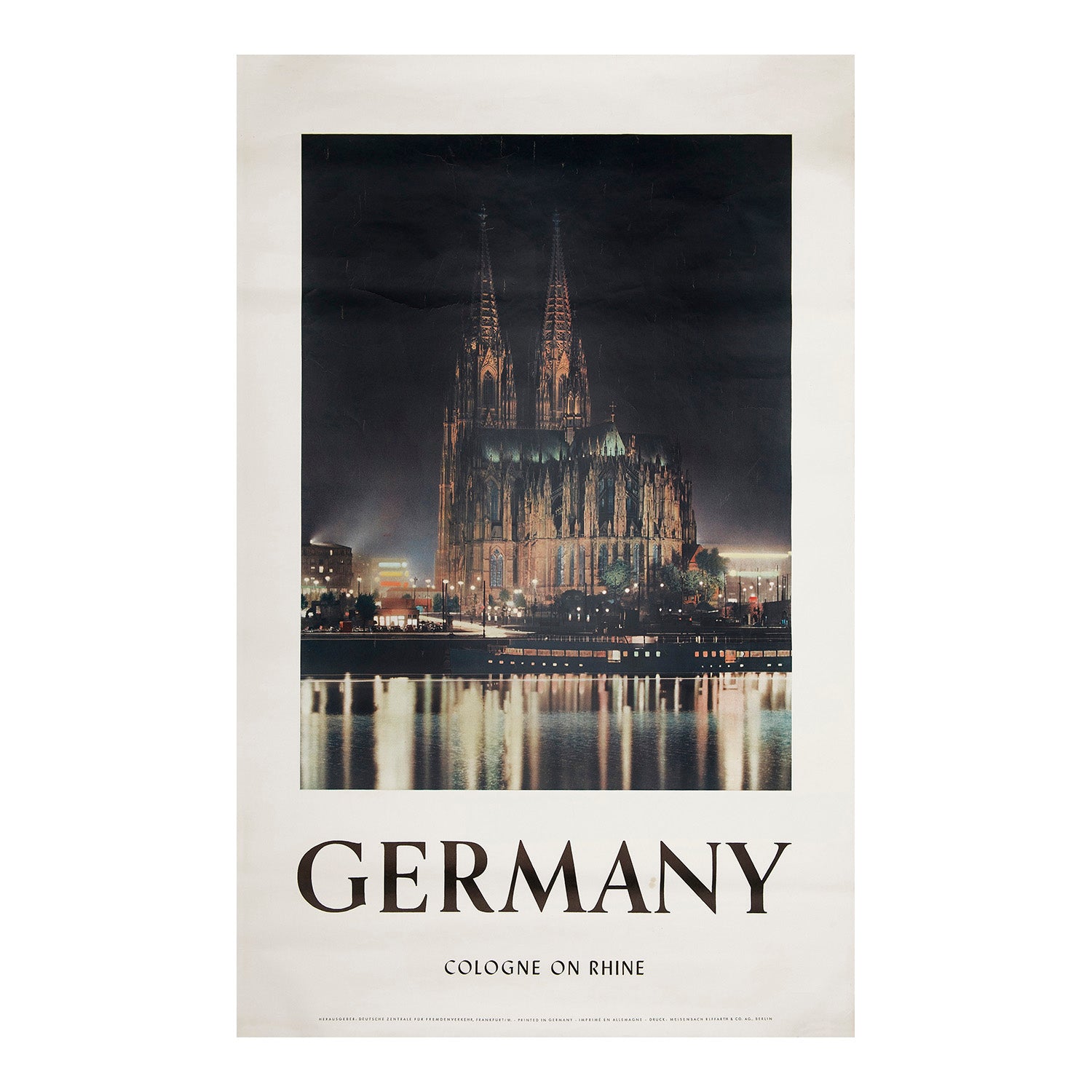 Original, photographic poster for Cologne published by the German National Tourist Board, c. 1950. Poster shows Cologne at night, with the caption 'Germany, Cologne on Rhine'.